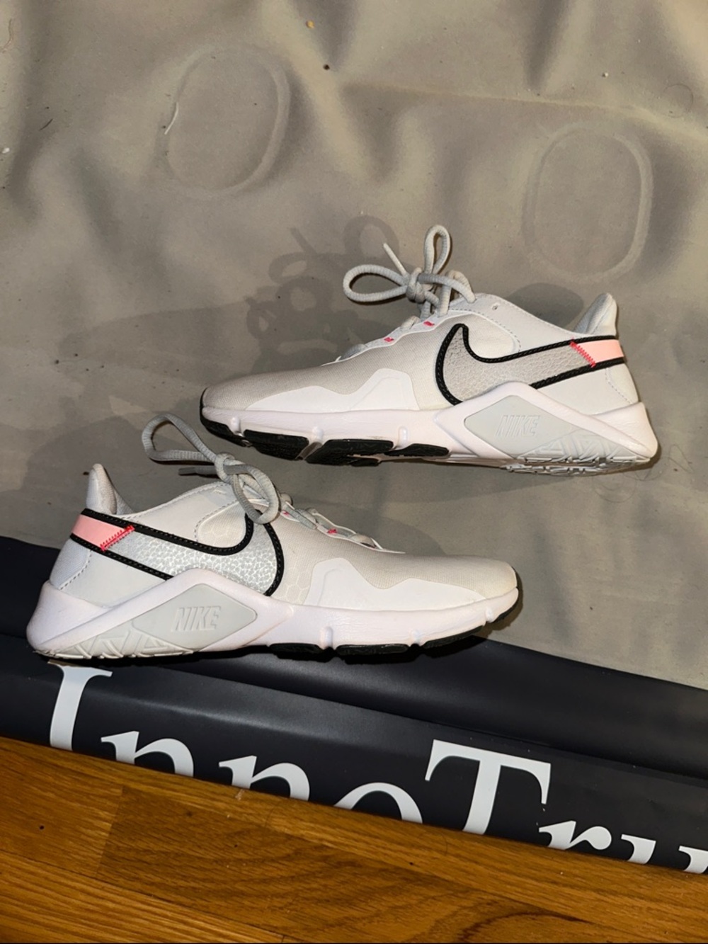 Nike Women’s Legend Essential 2 Sneakers in Pink and White